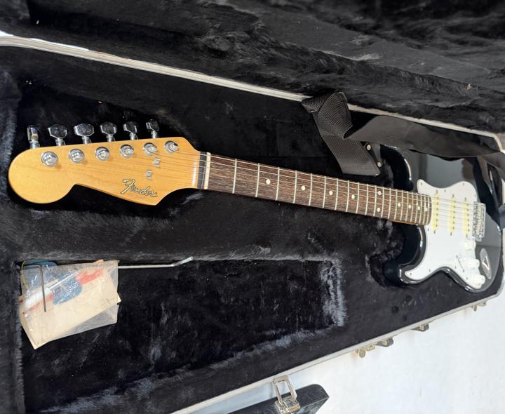 Black Fender Stratocaster in hard case