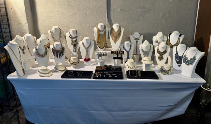 Full table of necklaces, bracelets and trays of jewelry