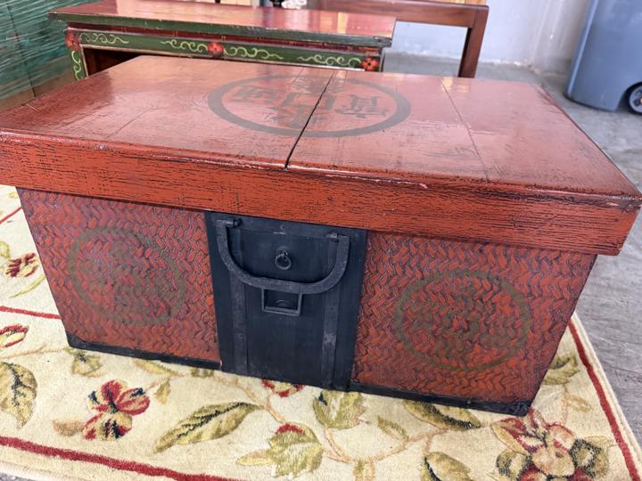 Red lacquered trunk with coin medallion lid