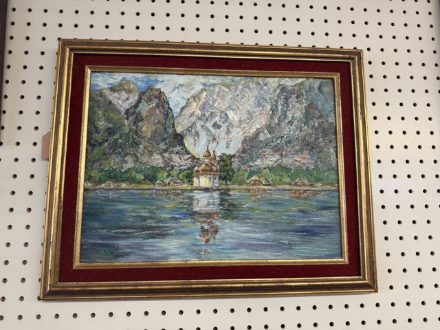 Textured impasto oil of an alpine lake with a domed chapel