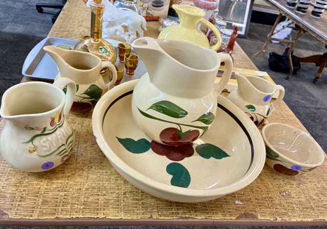 Apple-pattern pottery pitchers and bowls