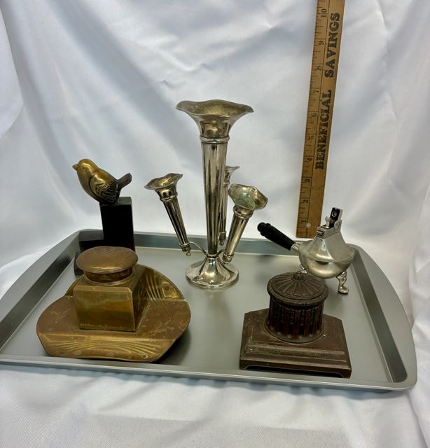 Brass inkwells, bird bookend, silverplate epergne and table lighter