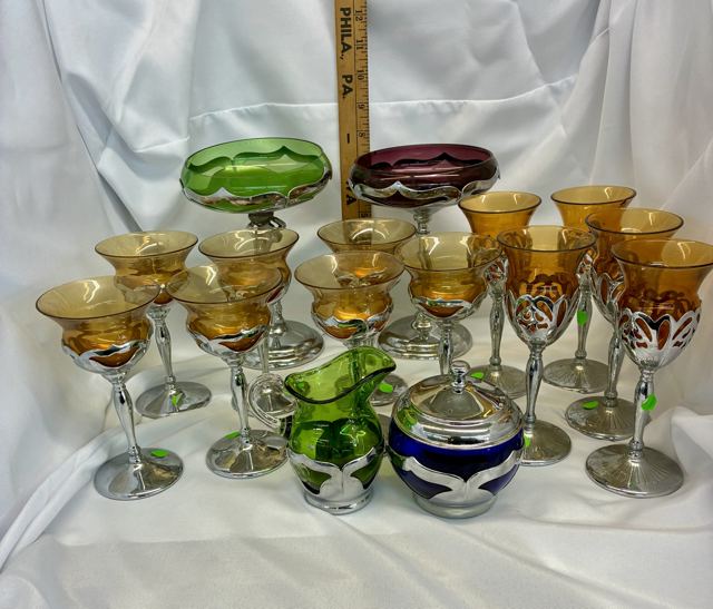 Chrome-overlay stemware set with amber goblets and green and amethyst compotes