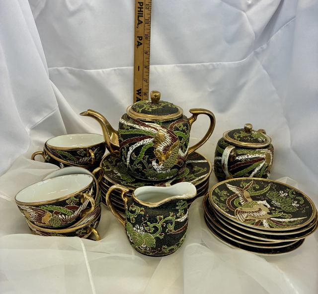 Black and gold dragon moriage tea set with teapot, cups and saucers