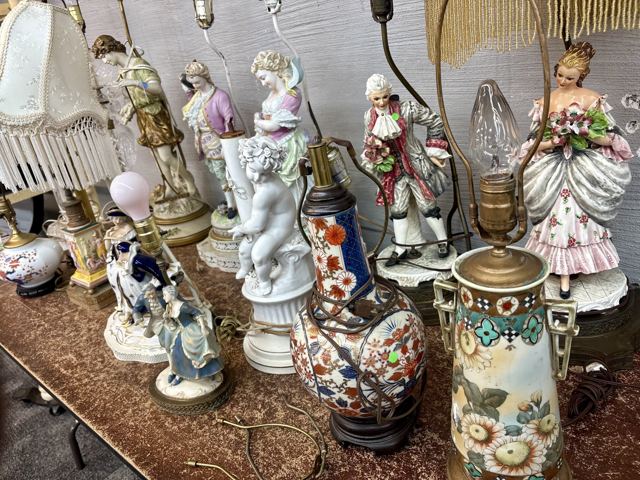 Figural porcelain lamps with Victorian couples and beaded shades