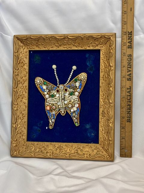 Framed jeweled rhinestone butterfly on blue velvet