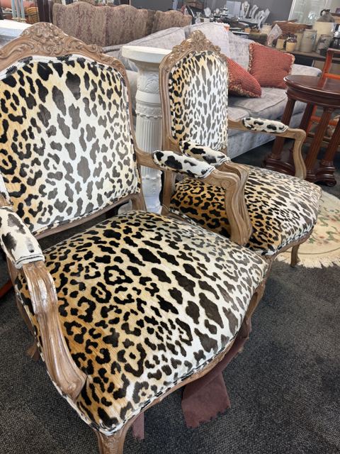 Pair of leopard-print French-style armchairs with carved frames