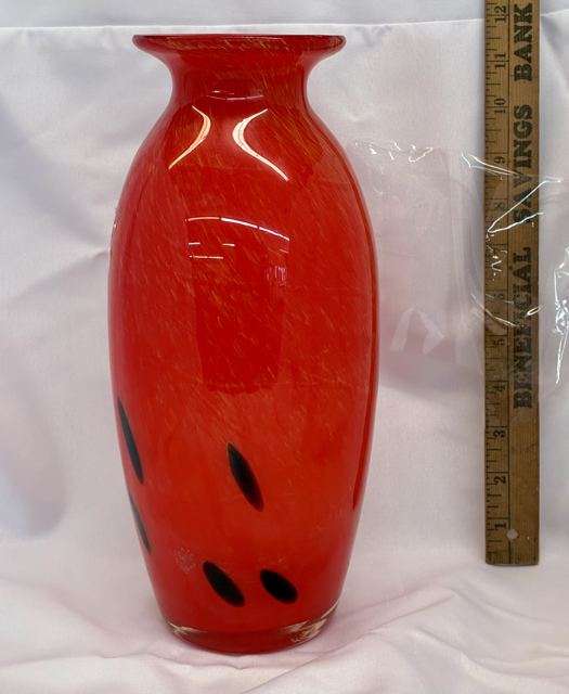 Red art glass vase with black spots
