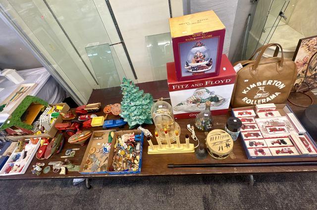 Tin toys, die-cast cars, ceramic Christmas tree and a Kimberton Rollerama bag