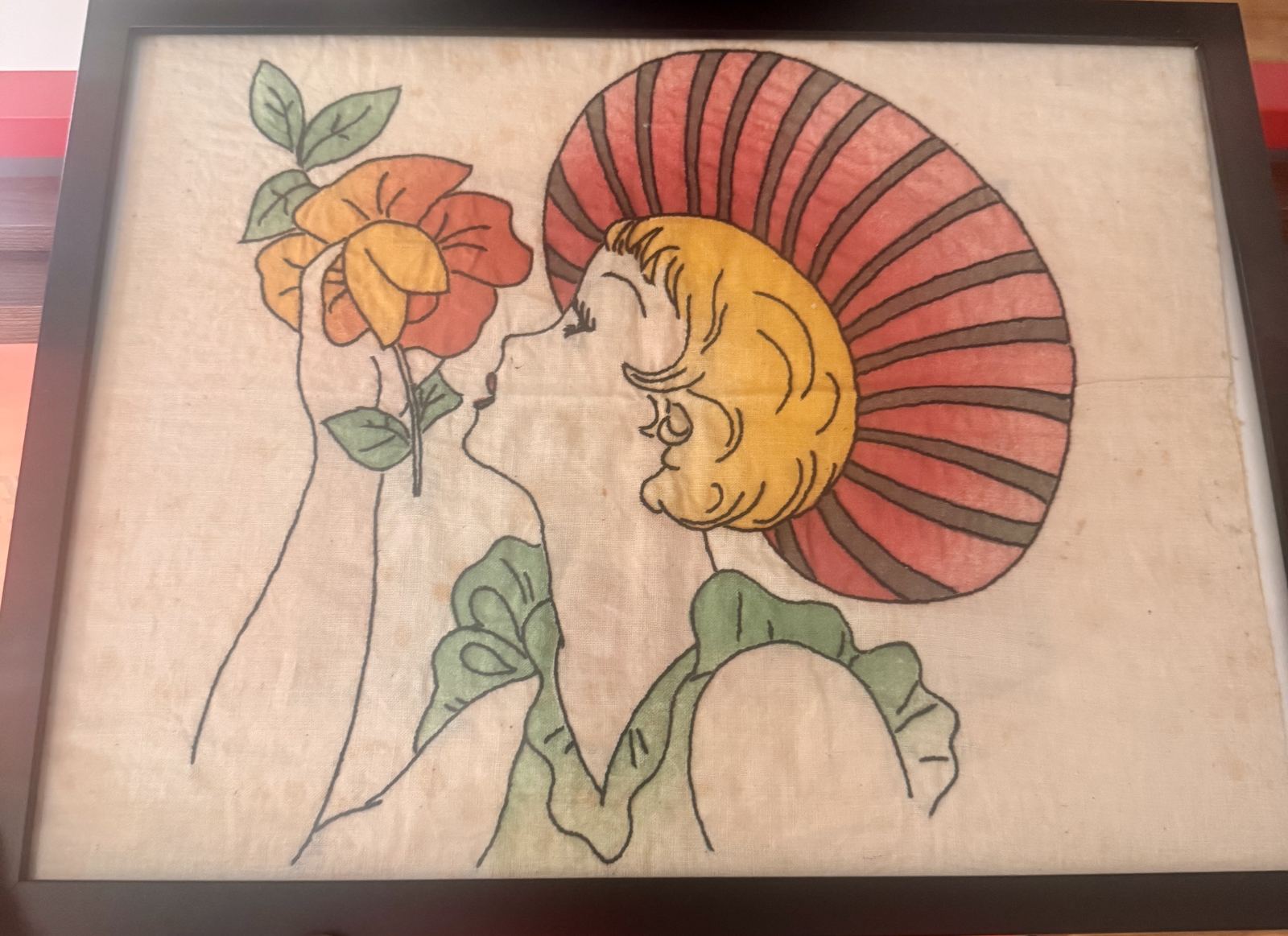 Framed Art Nouveau appliquéd textile, woman in profile with a rose