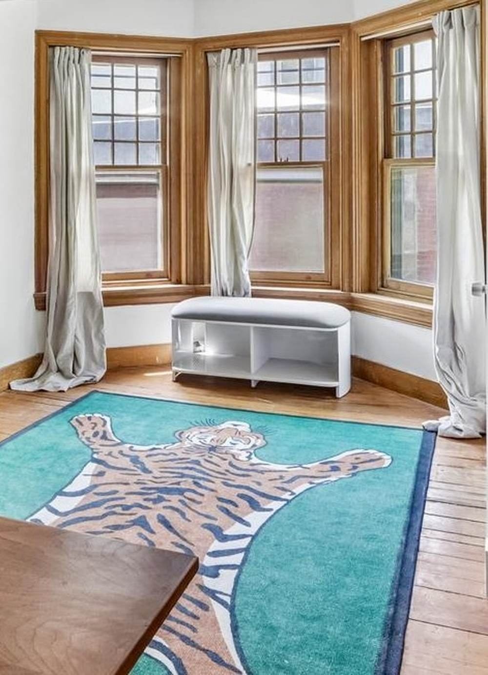 Bay window room with tiger rug