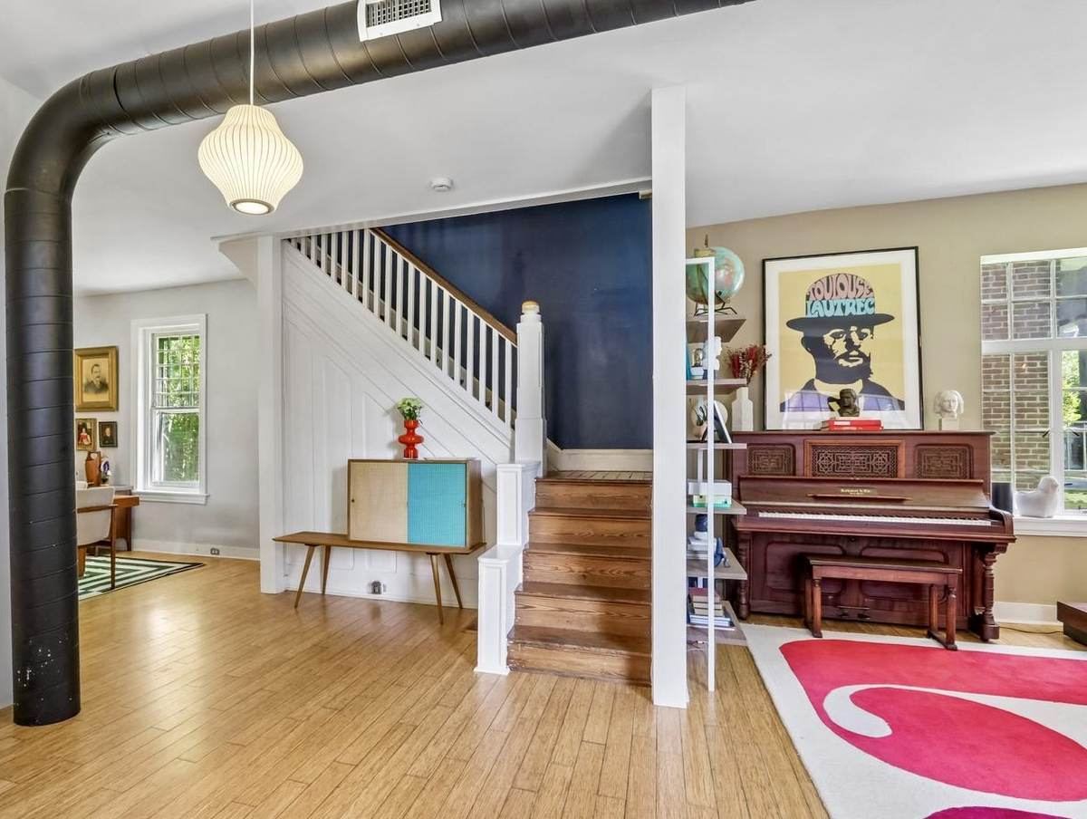 Piano and staircase with vintage furniture