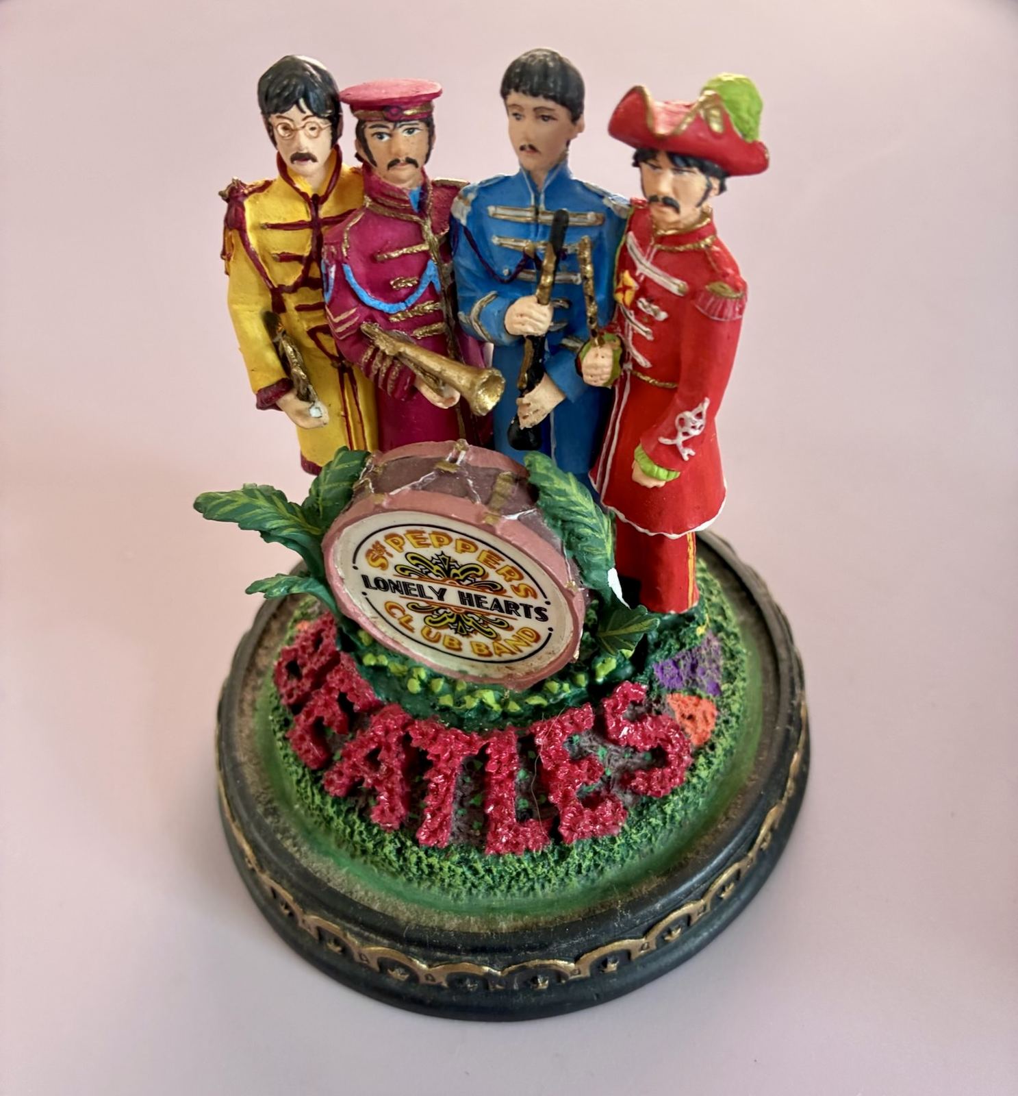 Sgt. Pepper's Lonely Hearts Club Band Beatles figurine on a display base