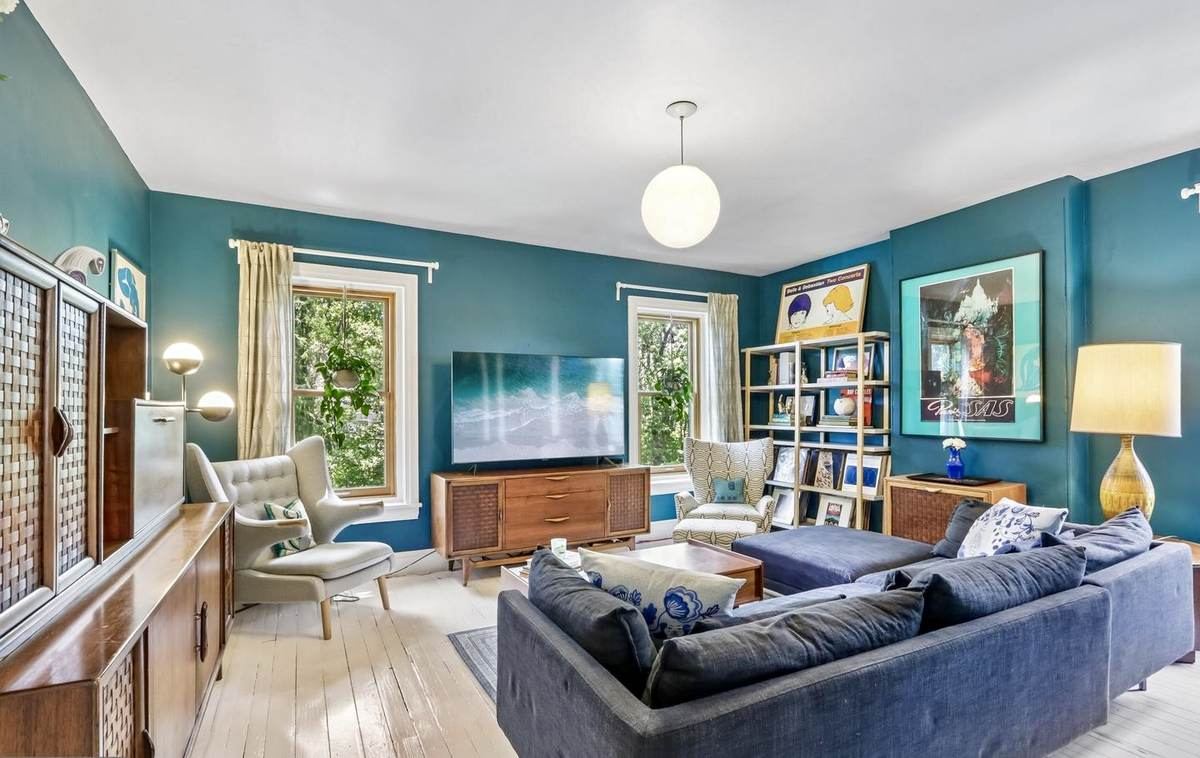 Teal den with Wegner-style chair and sectional